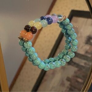 Turquoise w/ chakra colored beads. Hand crafted, purify mind, body, & sole.